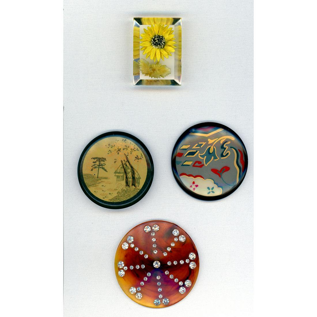 Small Card Of Assorted Plastic And Celluloid Buttons: 4 Extra large assorted plastic and celluloid buttons. This lot includes a beautiful 1950's reverse carved Lucite flower, a 1940's mock tortoise Bakelite with all over pastes, and 2 over 2 inch early c