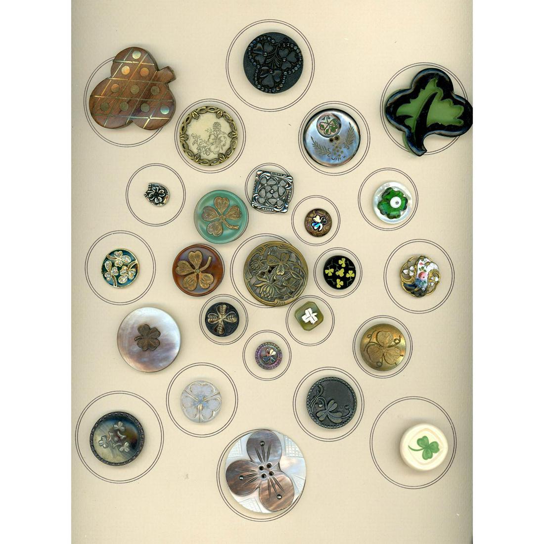 A Card Of Assorted Material 3 & 4 Leaf Clover Buttons: 25 S/M/L 3 & 4 Leaf Clover buttons in assorted materials. The buttons in this lot stem from the 19th and 20th centuries and include Bakelite, Pearl, Brass, wood, celluloid, enamel and more. Not an eas