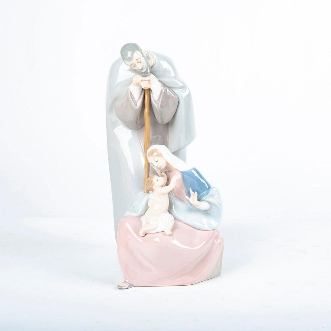 Lladro Porcelain Figurine, Blessed Family 01001499: Mary and Joseph lovingly look at their baby Jesus. Spanish Name: Sagrada Familia. Year Retired: 1998. Does not include the original box. #lladro Artist: Fulgencio Garcia Issued: 1986 Dimensions: 10.25