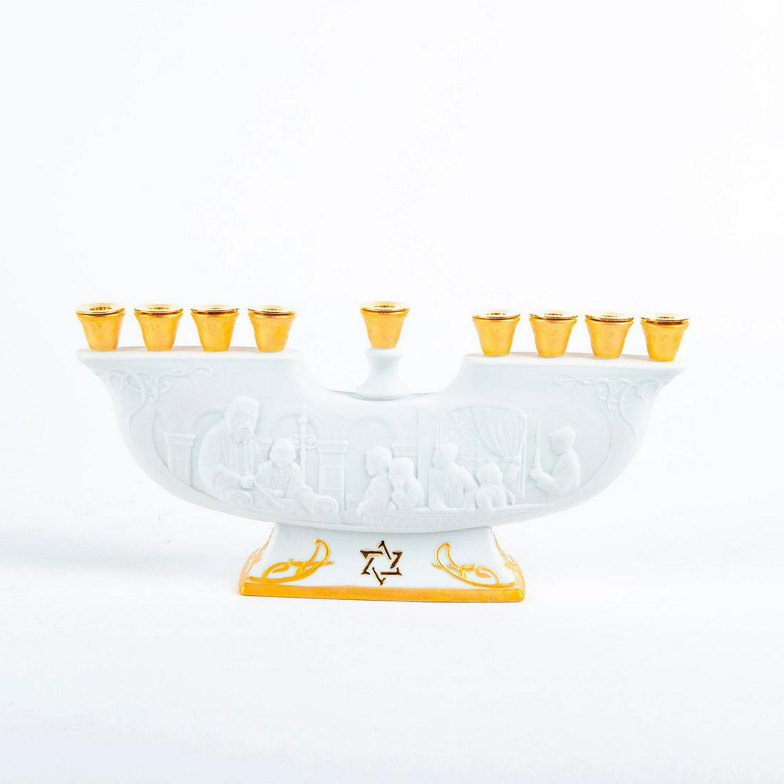 Lladro Candle Holder, Menorah 01006706: Matte white porcelain with gold gilt designed in high-relief. Lladro backstamp. Includes original box. Does not include candles. Artist: Design and Decoration Department Issued: 2007 Dimensions: 11.75