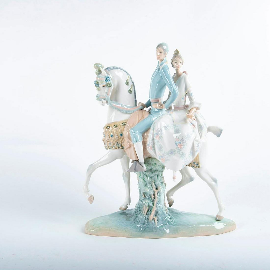 Lladro Figurine Grouping, Valencias Group 01004648: Glossy porcelain; modeled as a couple on a white horse. Lladro backstamp. Does not include original box. Artist: Fulgencio Garcia Issued: 1969 Dimensions: 17"H Manufacturer: Lladro Country of Origin: