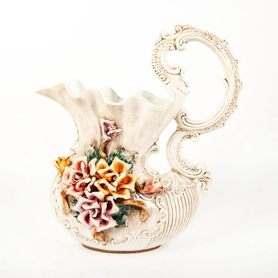 Capodimonte Large Porcelain Floral Vase Pitcher: Hand painted and decorated in high-relief with large pastel colored roses. Large elaborate handle. Scalloped rim. Designed in high-relief scroll decor with single figurative bust. Capodimonte mark Mad