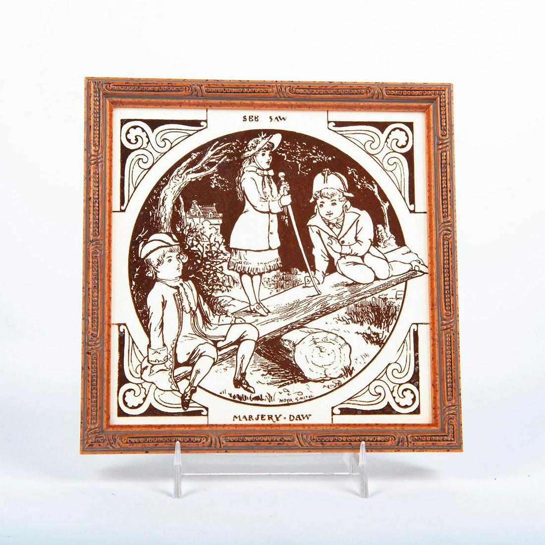Minton Moya Smith Ceramic Tile, Seesaw, Framed: Based on Seesaw Margery Daw nursery rhyme. Features 3 children on a seesaw. Signed on piece. Housed in square wooden frame. Artist: Moya Smith Issued: 20th c. Dimensions: 6.75"L x 6.75"W Manufacturer: