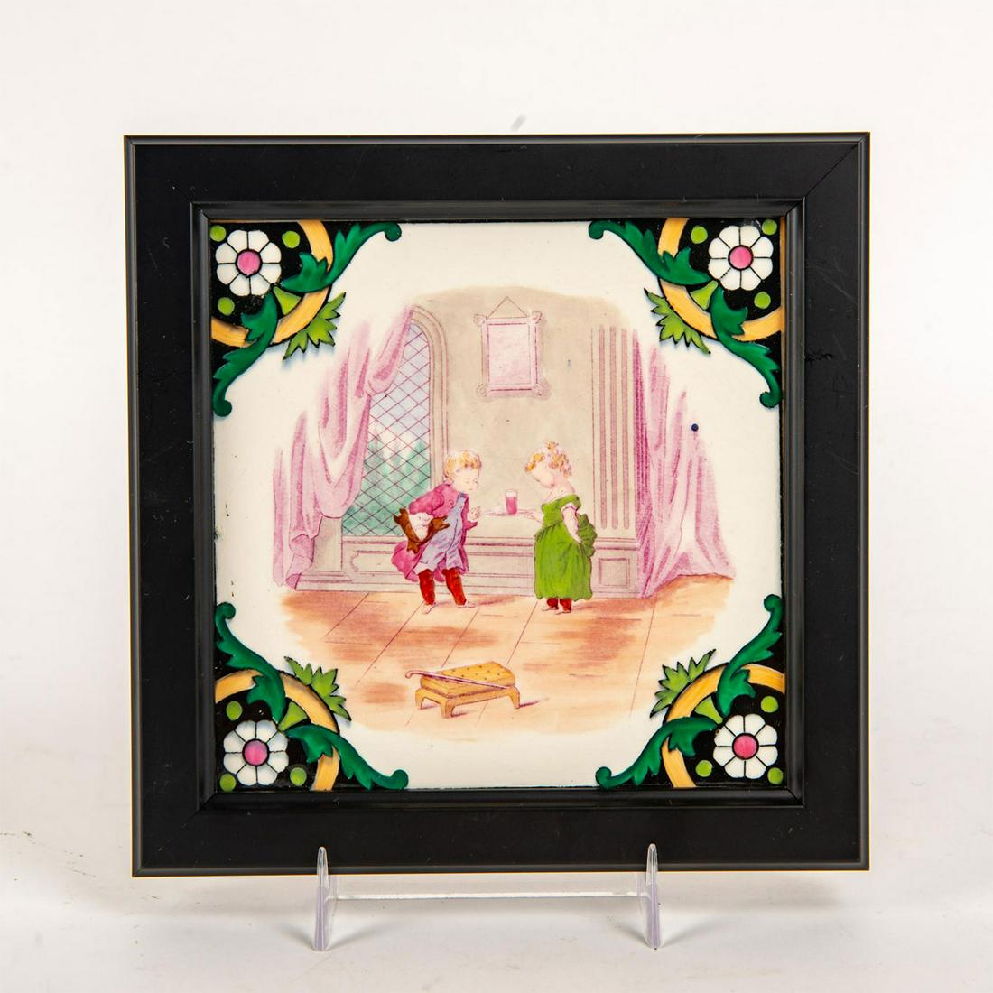 Minton Victorian Style Tile, Children's Tea Party,: Children's Games Series. Polychrome scene with floral border; housed in black frame. Minton Hollins and Co. backstamp. Issued: c. 1880 Dimensions: 7.25"W x 7.25"H Manufacturer: Minton, Hollins and Co.