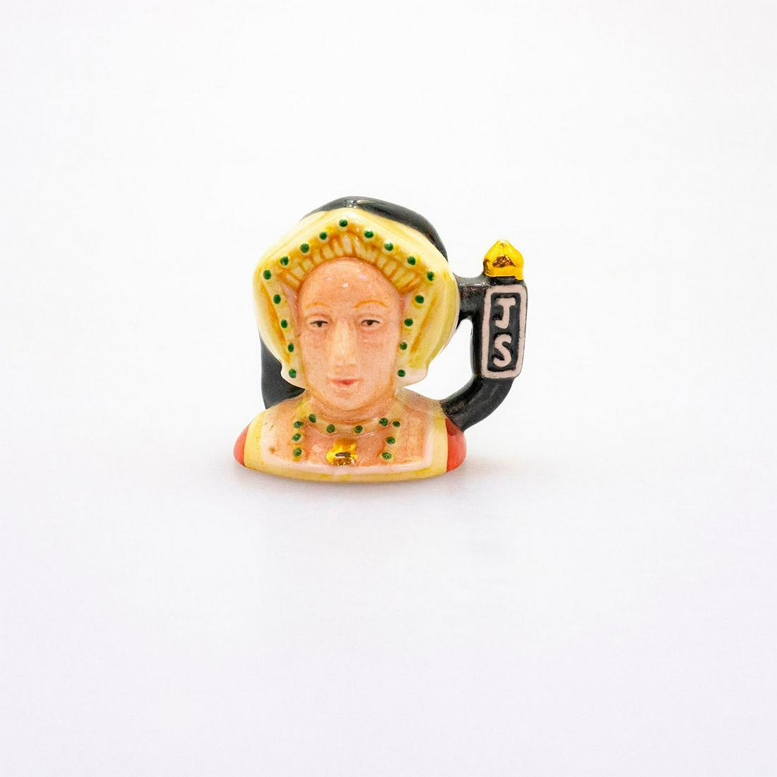 Royal Doulton Tiny Character Jug, Jane Seymour D7043: Yellow and black coloration with initials JS to handle. One of King Henry VIII six wives. Issued in 1996 in a limited edition of 2,500. Royal Doulton backstamp. Artist: William K. Harper Issued: 1996 