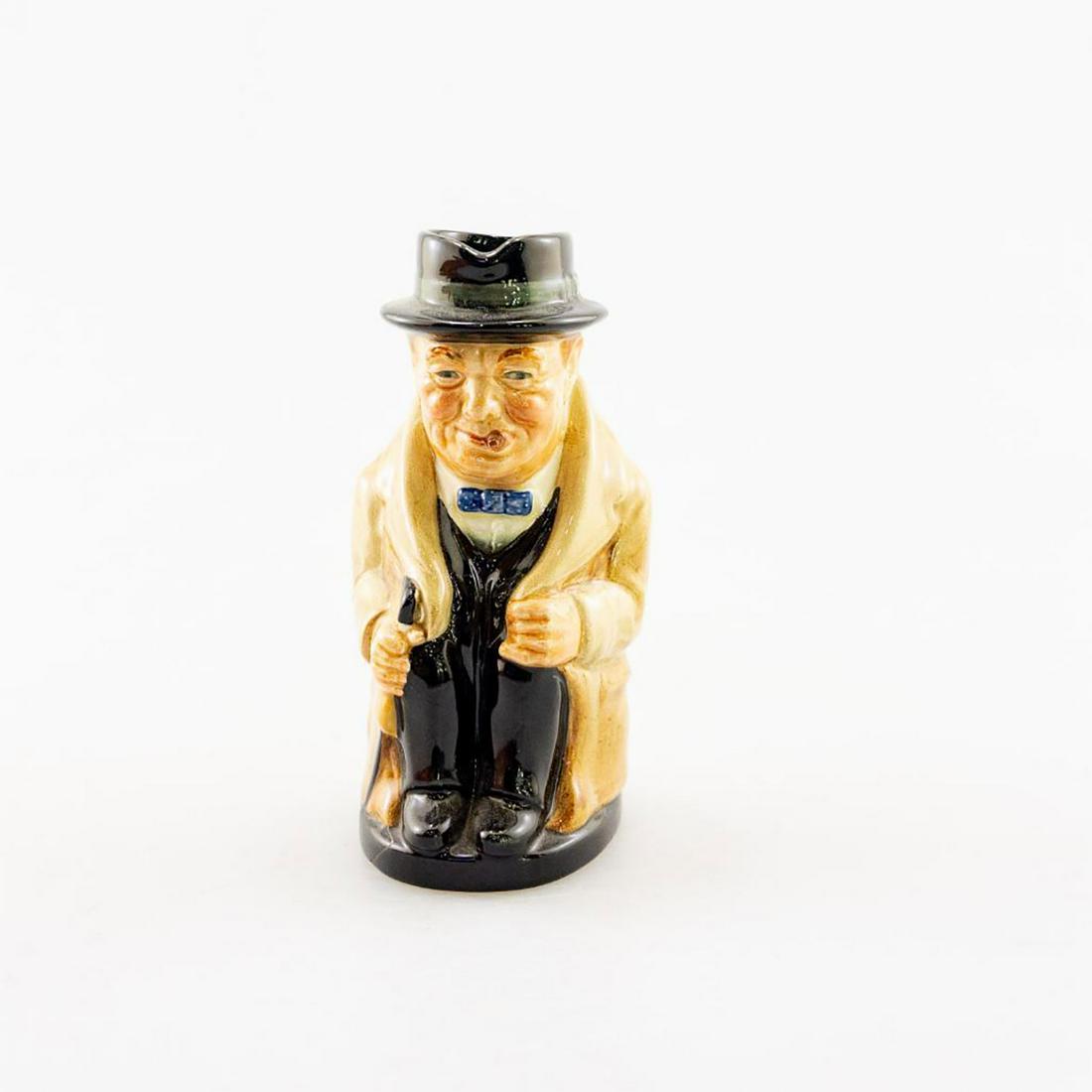 Royal Doulton Toby Jug, Winston Churchill: Winston Churchill sitting with cigar in mouth. Modeled by one of Royal Doulton most prolific modelers, Harry Fenton, in 1940. Issued: 20th c. Dimensions: 8.5"H Manufacturer: Royal Doulton Country of O