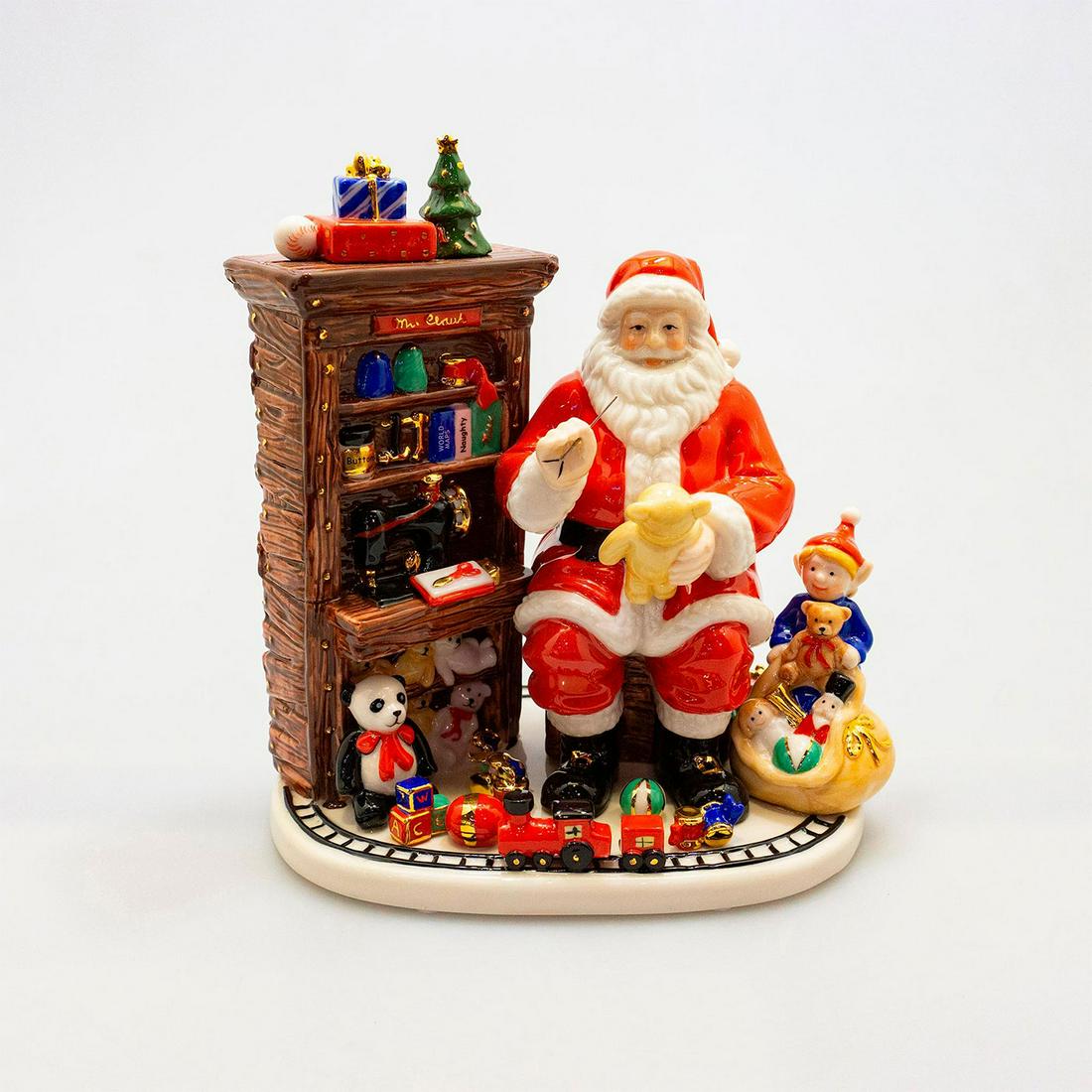 Santa'S Workshop Hn5312 - Royal Doulton Figurine: Beautiful hand-painted Doulton Christmas figure. Artist: Doulton Studios Issued: 2008; Ltd. 5,000 Dimensions: 8.25"H Manufacturer: Royal Doulton Country of Origin: England