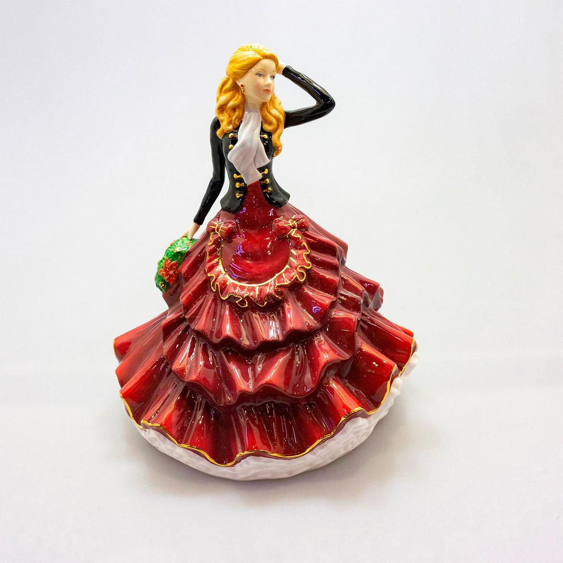 Season Of Joy - 2017 Christmas Day Figure Of The Year: Designed by Neil Faulkner, she carries a wreath of poinsettia and berries. Artist: Neil Faulkner Issued: 2017 - Dimensions: 9"H x 8."W Manufacturer: Royal Doulton Country of Origin: England