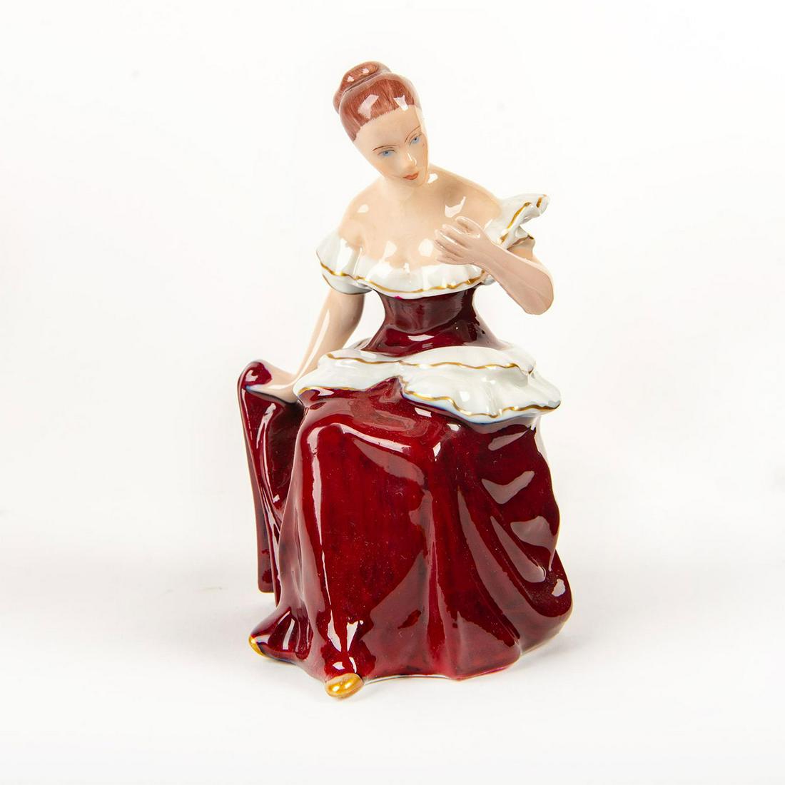 Royal Dux Porcelain Figurine, Seated Woman: Hand painted porcelain; red dress with white garlands; gilt highlights. Royal Dux backstamp. Missing mirror in hand. Issued: 20th c. Dimensions: 6.25"H Manufacturer: Royal Dux Country of Origin: Czech