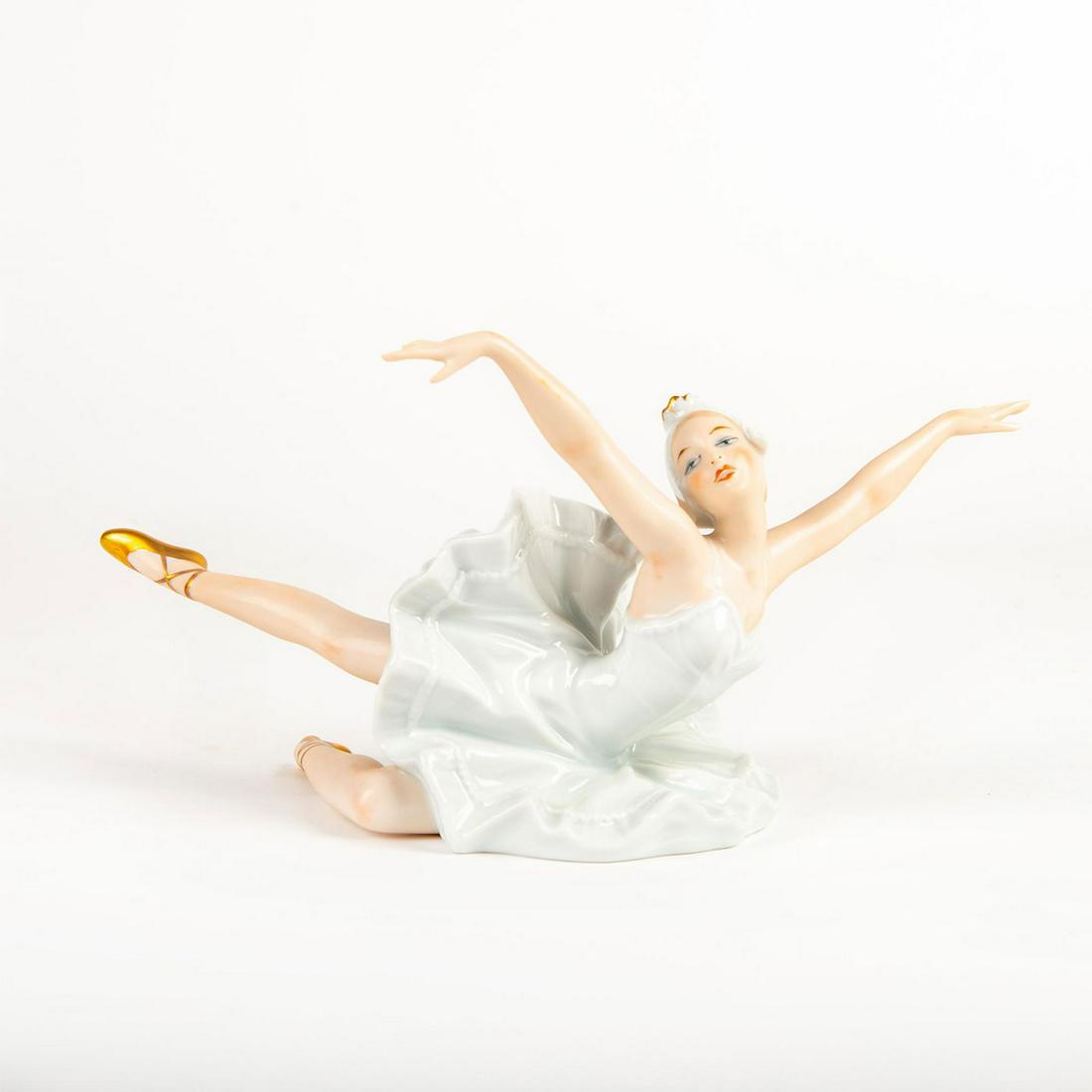 Wallendorf Swan Lake Ballerina Figurine, Dying Swan: Exquisite elegance and grace; hand painted face, pearl white costume; gold slippers. Wallendorf backstamp. Issued: 20th c. Dimensions: 8"W x 5.25"H Manufacturer: Wallendorf Country of Origin: Germany