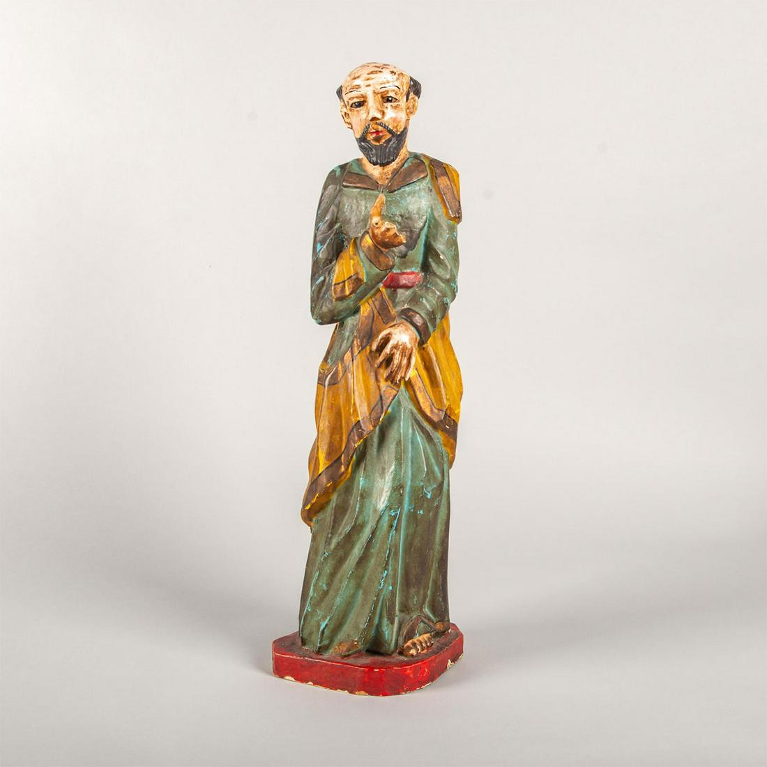 Large Vintage Wooden Character Statue, Saint Francis: Hand carved, hand painted. A stylized representation of an Italian Catholic friar. Dimensions: 20.25"H Condition: Missing fingers, age related wear to paint, few chips throughout.
