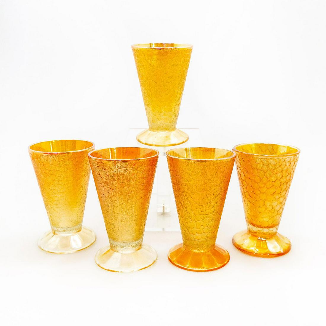 5 Vintage Jeannette Glass Iridescent Parfait Glasses: Carnival glass pedestal dessert cups; crackle pattern; marigold colorway. Unmarked. #DEPRESSIONGLASS Issued: 20th c. Dimensions: 4.75"H x 3"W Manufacturer: Jeannette Glass Country of Origin: United St