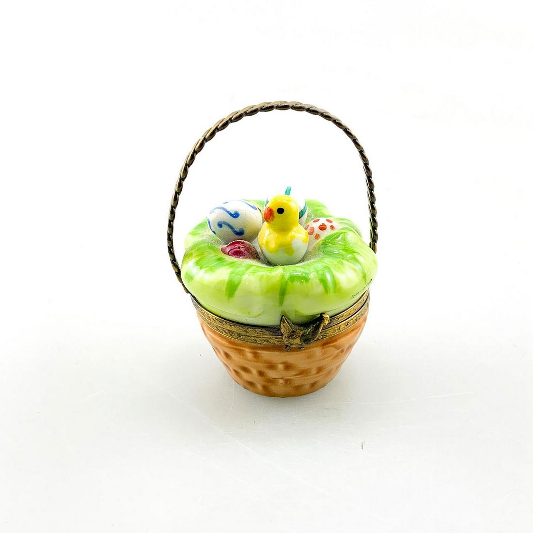 Vintage Limoges France Trinket Easter Box Basket: Lovely Limoges box of an easter basket with baby chick on the interior of the basket. With bronze handle and molded with easter eggs and a baby yellow chick in grass. Marked Peint Main Limoges France 