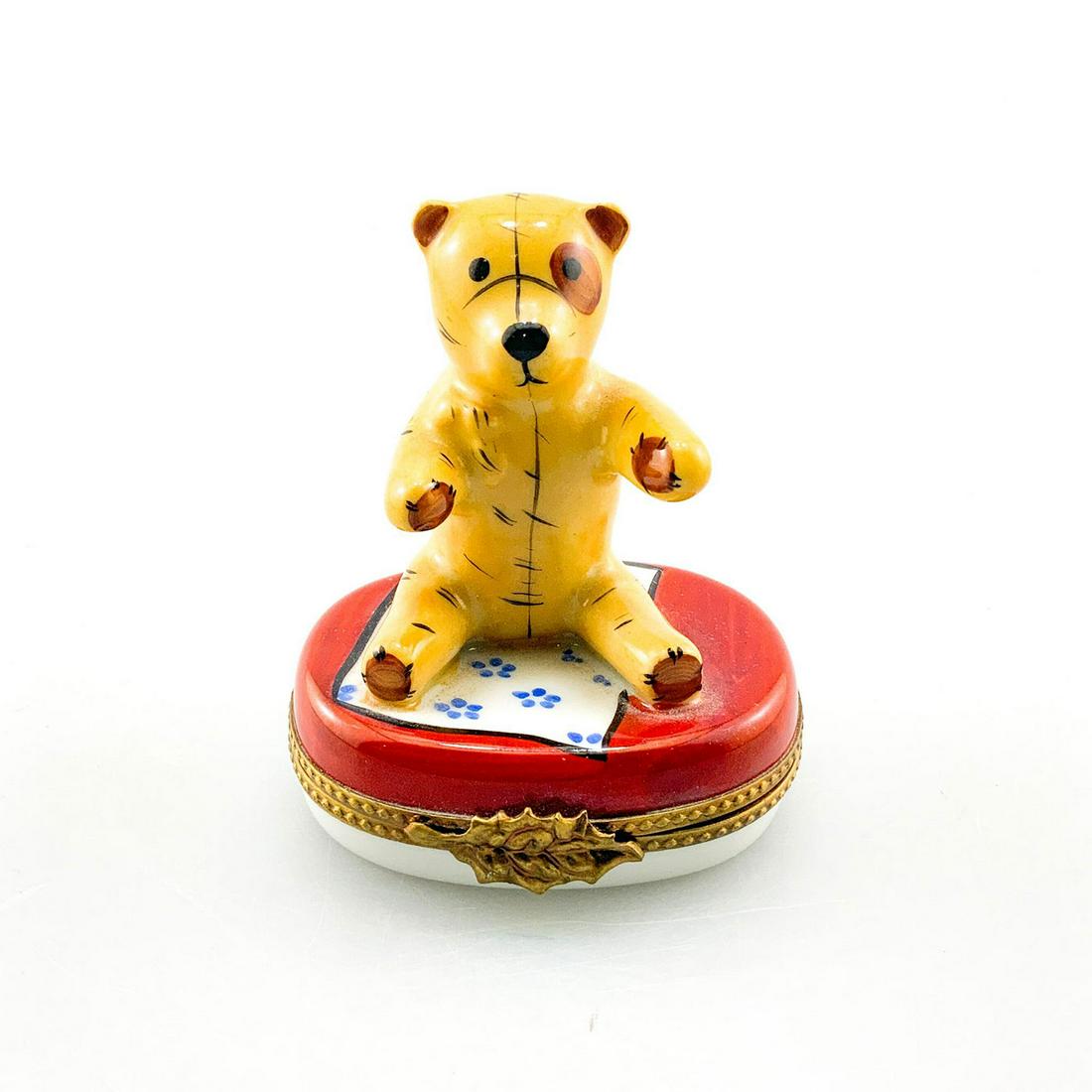 Vintage Limoges Box Of A Teddy Bear: Limoges trinket box of a teddy bear on a blue flower rug. Marked Peint Main Limoges France Lagloriette (seal) to base.