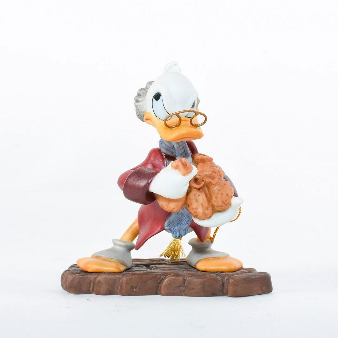 Disney Classics Ornament, Scrooge McDuck , Bah-Humbug!: Scrooge McDuck greedily grasps his bags of money and gold with an stern expression. From Mickey's Christmas Carol. Porcelain ornament with metal spectacles. #disney