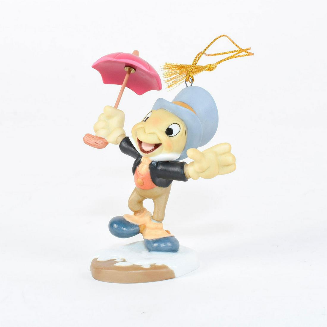 Disney Ornament, Jiminy Cricket, Mickey's Christmas: Jiminy Cricket joyfully holds his umbrella in his dapper top hat and outfit. Ceramic figure ornament of Jiminy Cricket from the 1983 film 'Mickey's Christmas Carol'. #disney