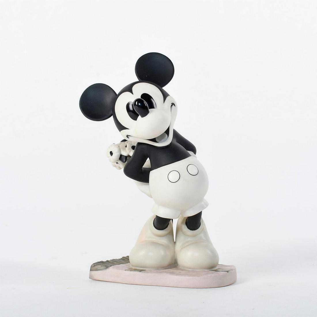 Disney Classics Figurine, Mickey Mouse, Puppy Love: Mickey stands with his hands behind his back holding a bouquet of flowers. Black and white ceramic figure of Mickey from the 1933 film 'Puppy Love'. "Brought You Something" quote on bottom. #disney #m