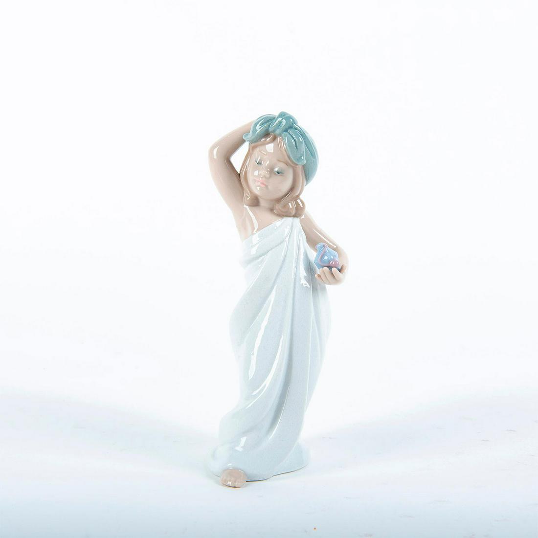 Lladro Porcelain Figure, Just Like New 1006799: A sweet young girl poses in her headscarf and toga after her bath. Spanish Name: Soy Tan Bonita. In original box #lladro Artist: Jose Santaeulalia Issued: 2001 Dimensions: 7.5"H Country of Origin: Spa