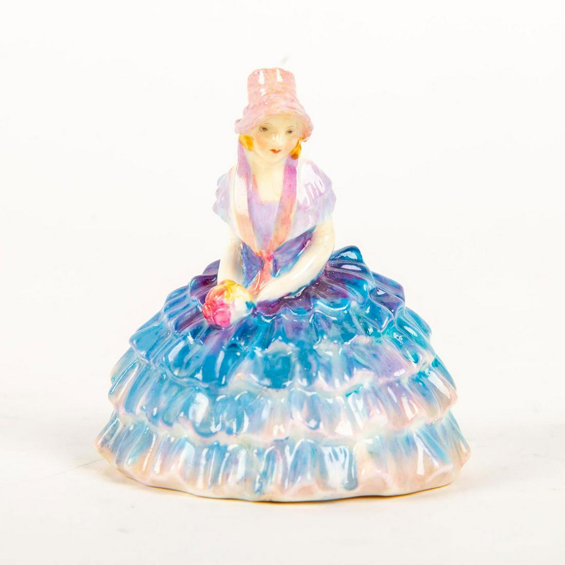 Royal Doulton Miniature Figurine, Chloe M10: Seated; wearing a lavender and blue layered dress. Titled on base. Doulton backstamp. Artist: Leslie Harradine Issued: 1932 - 1945 Dimensions: 3"H Manufacturer: Royal Doulton Country of Origin: Englan