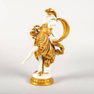 Ernst Bohne & Sohne Figurine, Female Dancer: White porcelain w. gilded gown and ribbons. Figure stands on gilt base w. floral detail. Manufacturer's backstamp. Fade to gilding. Issued: 20th c. Dimensions: 10.25"H Manufacturer: Ernst Bohne & Sohn