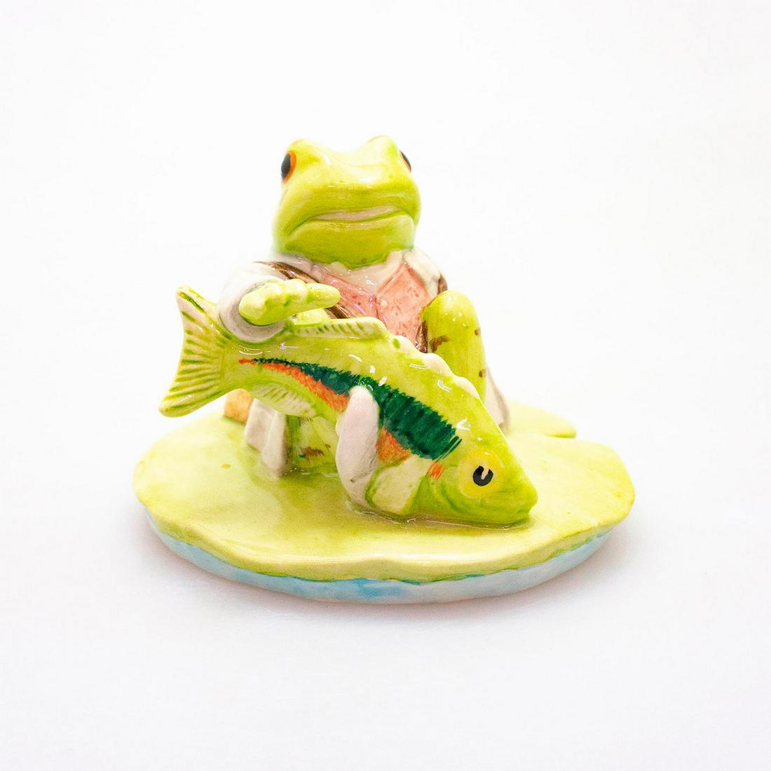 Beswick Beatrix Potter Figurine, Jeremy Fisher: Jeremy FIsher Catches A Fish. Modeled as a green frog. Beswick backstamp. Artist: Martyn Alcock Issued: 1999 - 2002 Dimensions: 3"H Manufacturer: Beswick Country of Origin: England