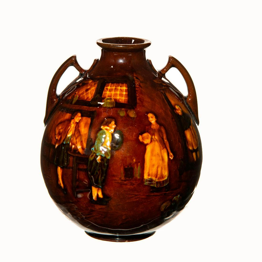Royal Doulton Kingsware Vase with Pub Scene: Kingsware vase with a pub scene on one side, featuring two men and two women. On the other side is a man sitting down near a fire pit. Royal Doulton backstamp. Artist: Charles Noke Dimensions: 6"H Man