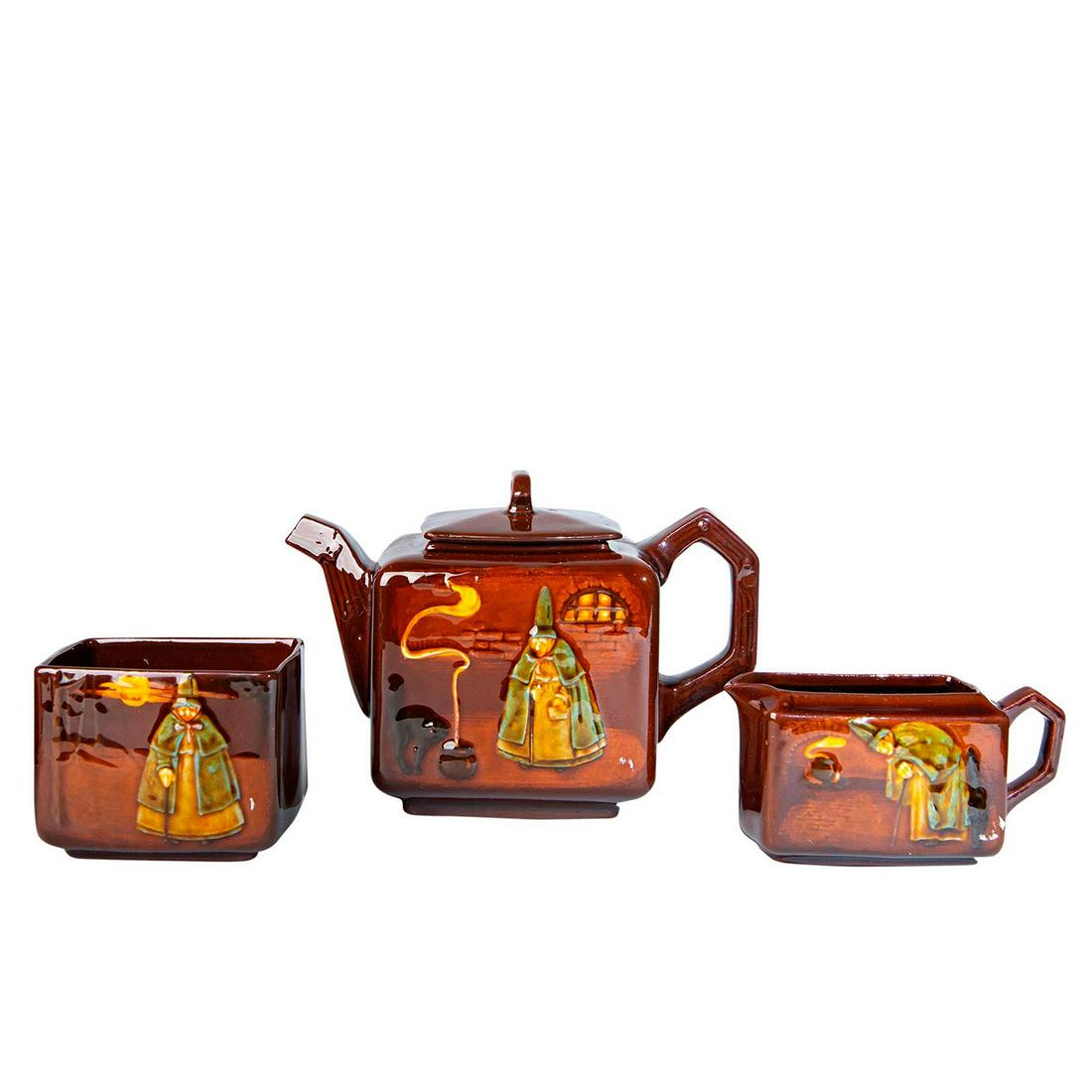 4PC Royal Doulton Kingsware Witch Tea Set: Kingsware brown glaze in relief. Includes lidded tea pot, creamer and sugar bowl. Royal Doulton backstamp. Teapot 5"H, creamer 2.5"H and sugar bowl 2.75"H. Issued: c. 1920 Manufacturer: Royal Doulton 