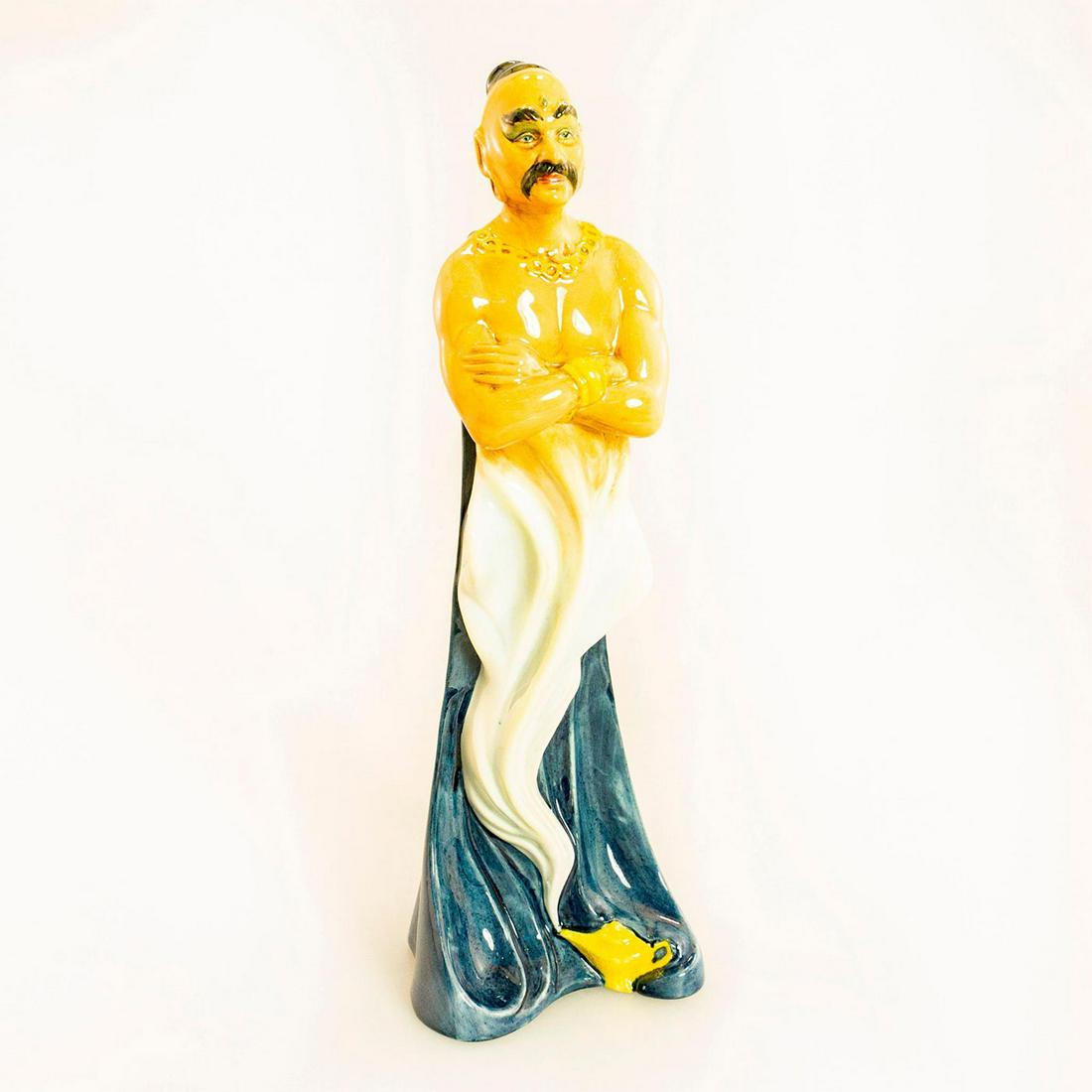 Genie HN2989 - Royal Doulton Figurine: Glossy porcelain figurine; A fun figurine of a genie coming out of his lamp. In a world where old fashioned values seems to be long gone, a tradition of craftsmanship still lives on in the Royal Doult
