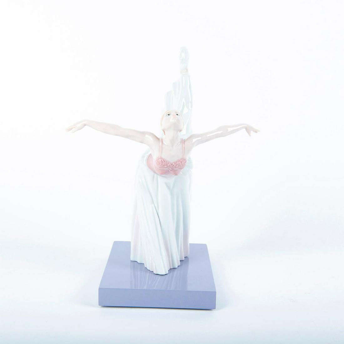 Giselle Arabesque 01008475 - Lladro Porcelain Figure: Ballet dancer in long skirt practicing an elegant pose; mounted on base. Includes box. Lladro backstamp. Artist: Javier Molina Issued: 2009 Dimensions: 11"H Manufacturer: Lladro Country of Origin: Spa