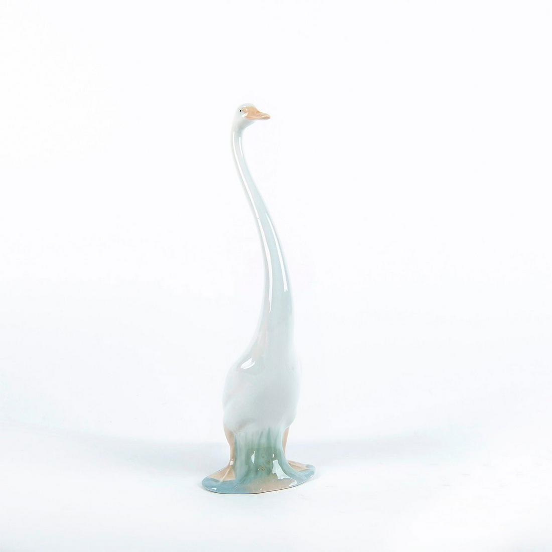 Nao Lladro Porcelain Figurine, Goose 02000052: Glossy porcelain figure; white goose. Back reads "Made in Spain". Does not include box. Artist: Fulgencio Garcia Issued: 1960 Dimensions: 13.5"H Manufacturer: Lladro Country of Origin: Spain