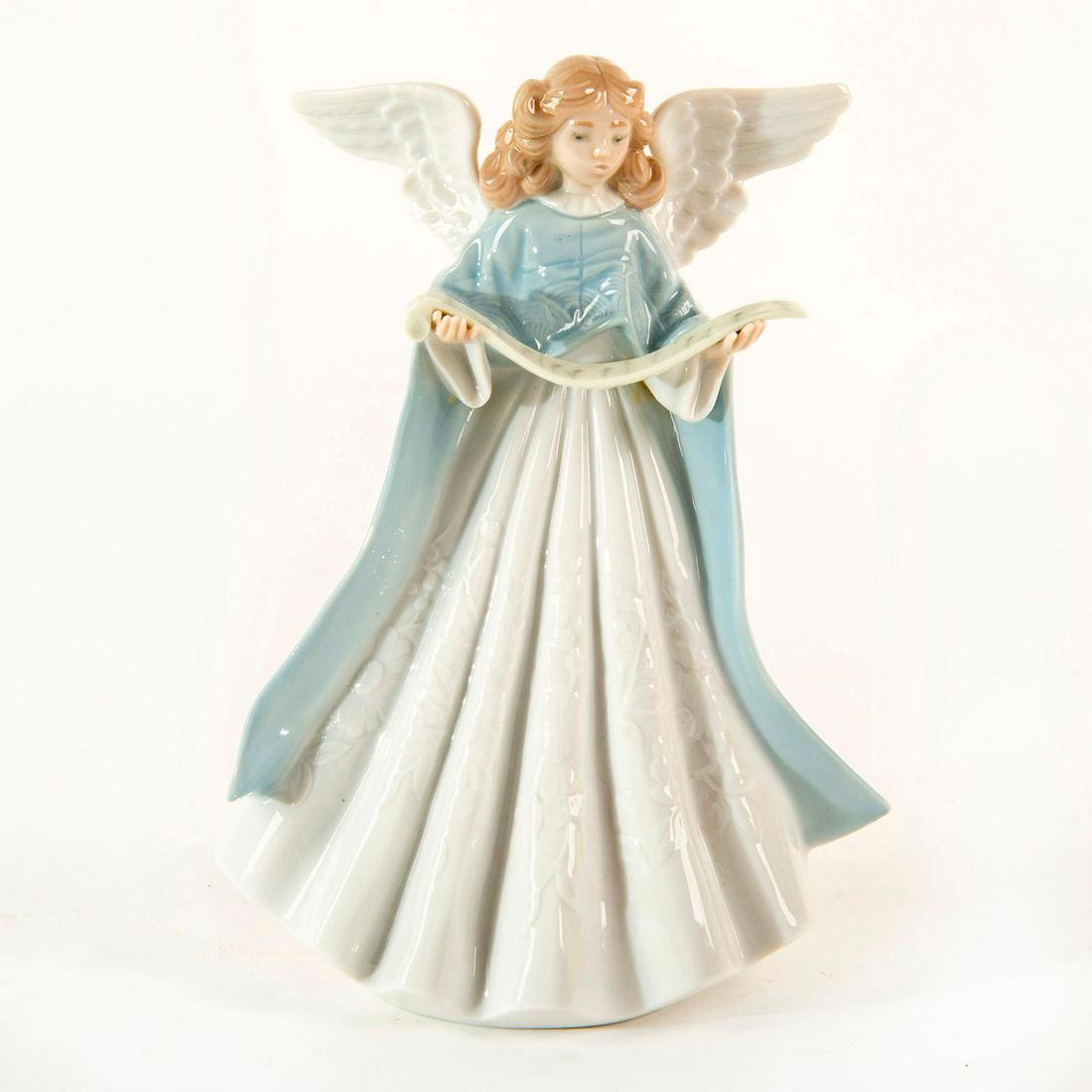 Tree Topper '90 (Blue) 1990/1990 01005719 - Lladro: A beautiful tree topper in a blue gown. Porcelain with a glossy finish. Lladro backstamp. Dimensions: 7"H