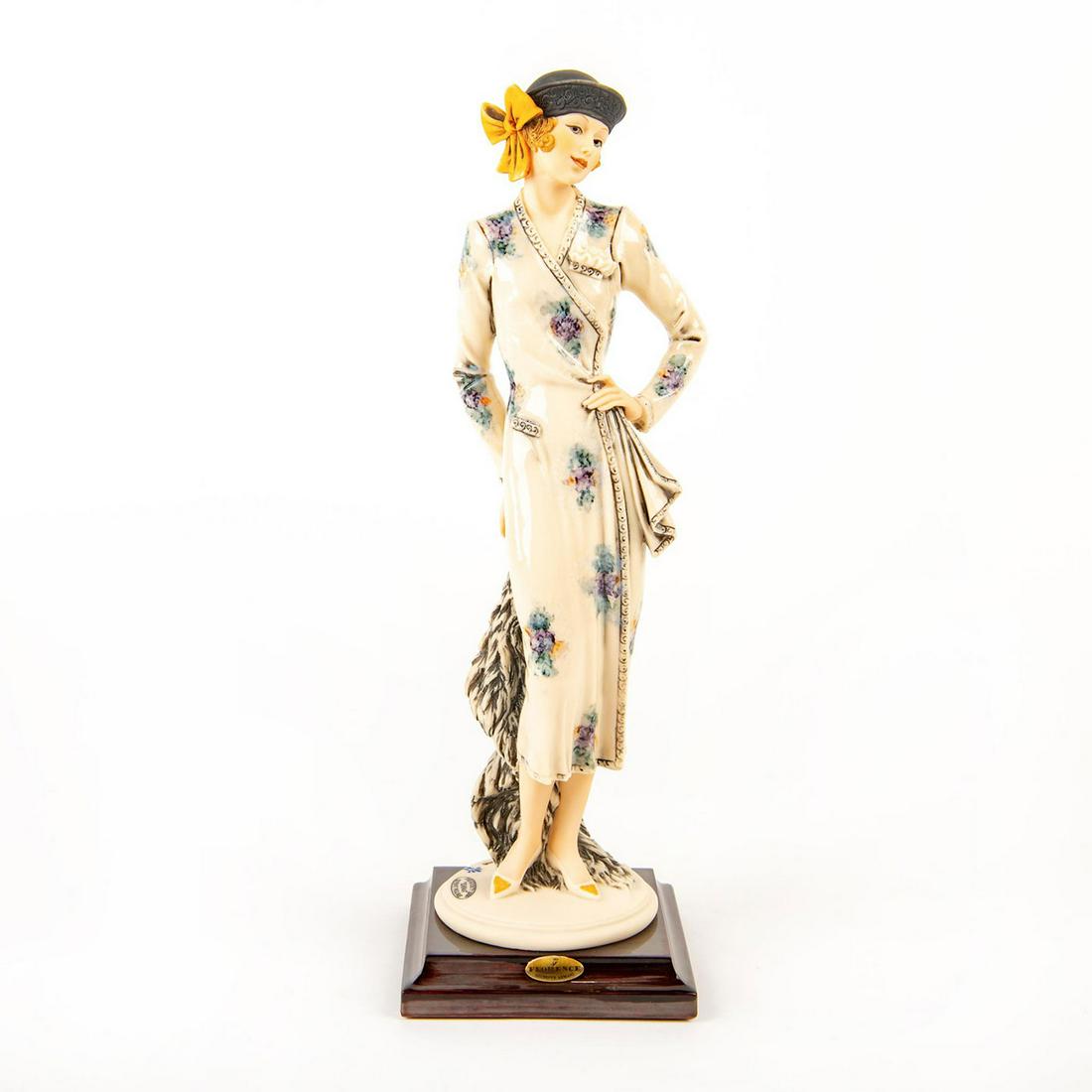 Florence Giuseppe Armani Porcelain Figurine, Emma 1330C: A stylishly dressed lady in a hat stands with one hand on her hip and the other holds a shawl. The Society 2000 Event Figure. #giuseppearmani Issued: 1999 Dimensions: 12"H Manufacturer: Florence Giuse