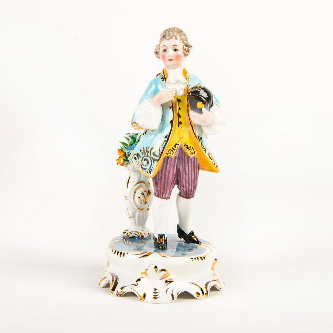 Italian Porcelain Figurine, Victorian Boy: On rococo style base. Glazed, accented with gold gilt. Bottom base marked Italy. Missing petals from flowers in vase. Issued: 20th c. Dimensions: 7.25"H Country of Origin: Italy