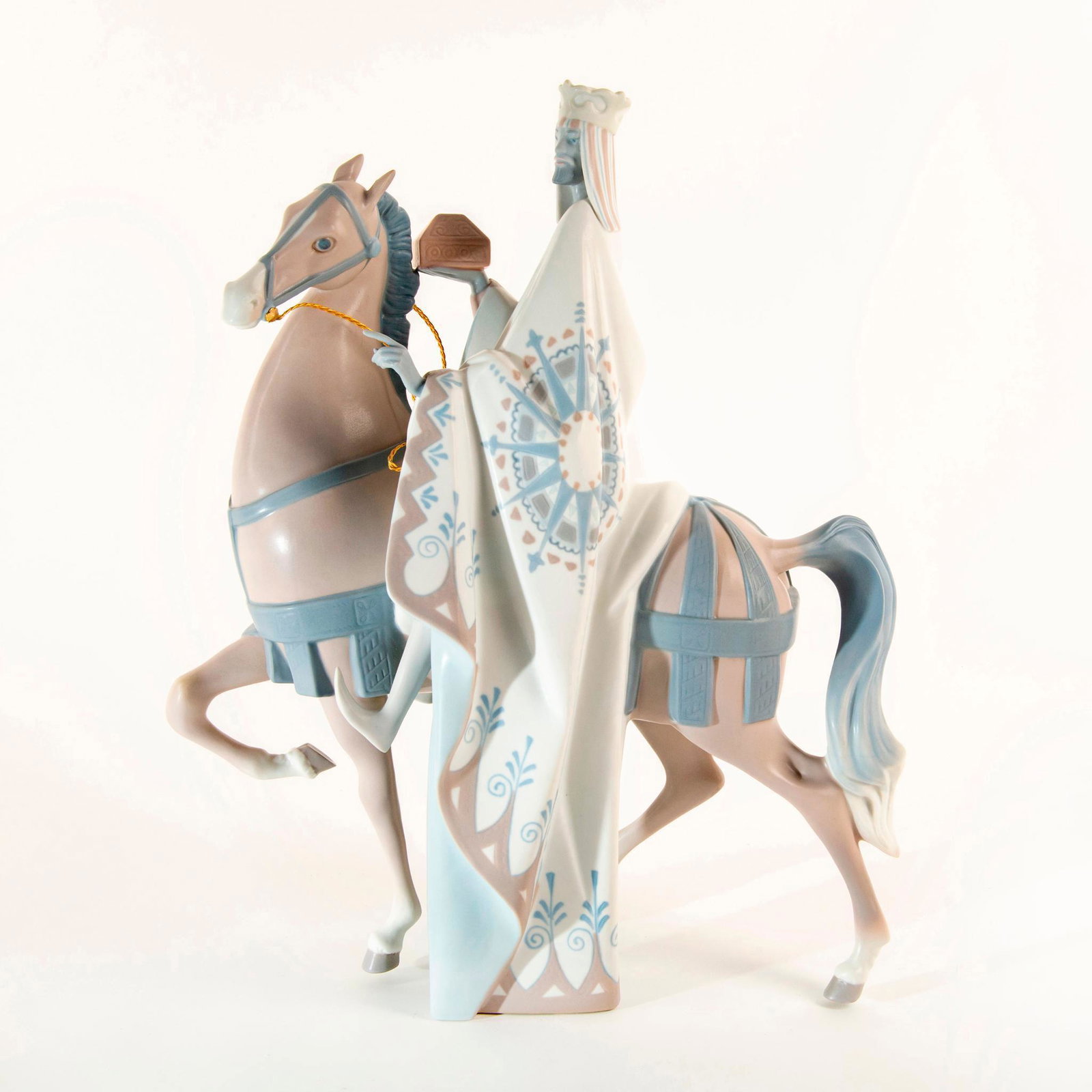 King Balthasar 01011020 - Lladro Porcelain Figure: King Balthasar, dressed in regal attire, sits prominently on his mighty steed with a gift box in his hand. Braided gold reins are featured. This item has been professionally restored. #lladro Artist: 