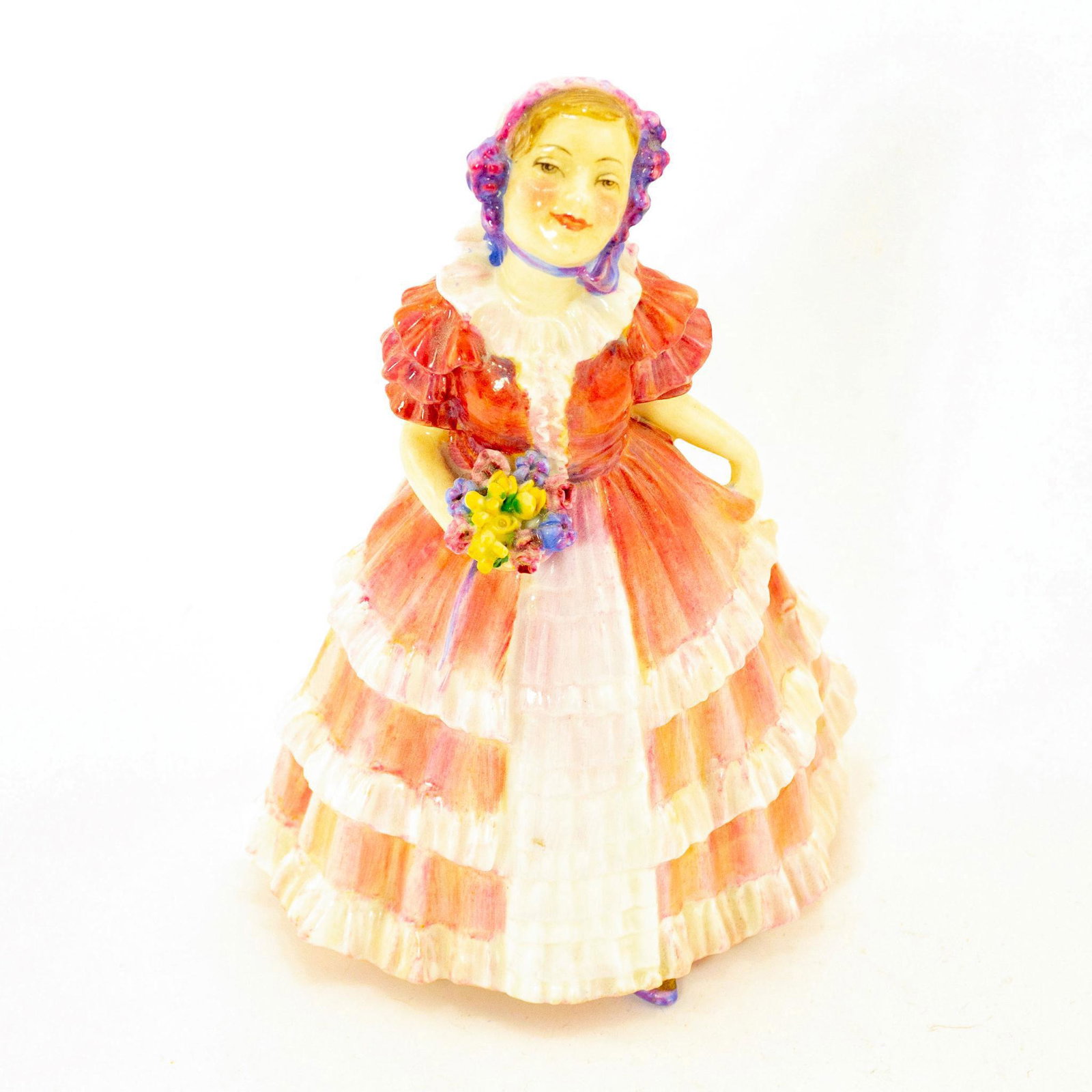 Ruby HN1724 - Royal Doulton Figurine: Harradine Child Classics. Pink and blue colorway. Doulton backstamp. Artist: Leslie Harradine Issued: 1935-1949 Dimensions: 5.25"H Manufacturer: Royal Doulton Country of Origin: England