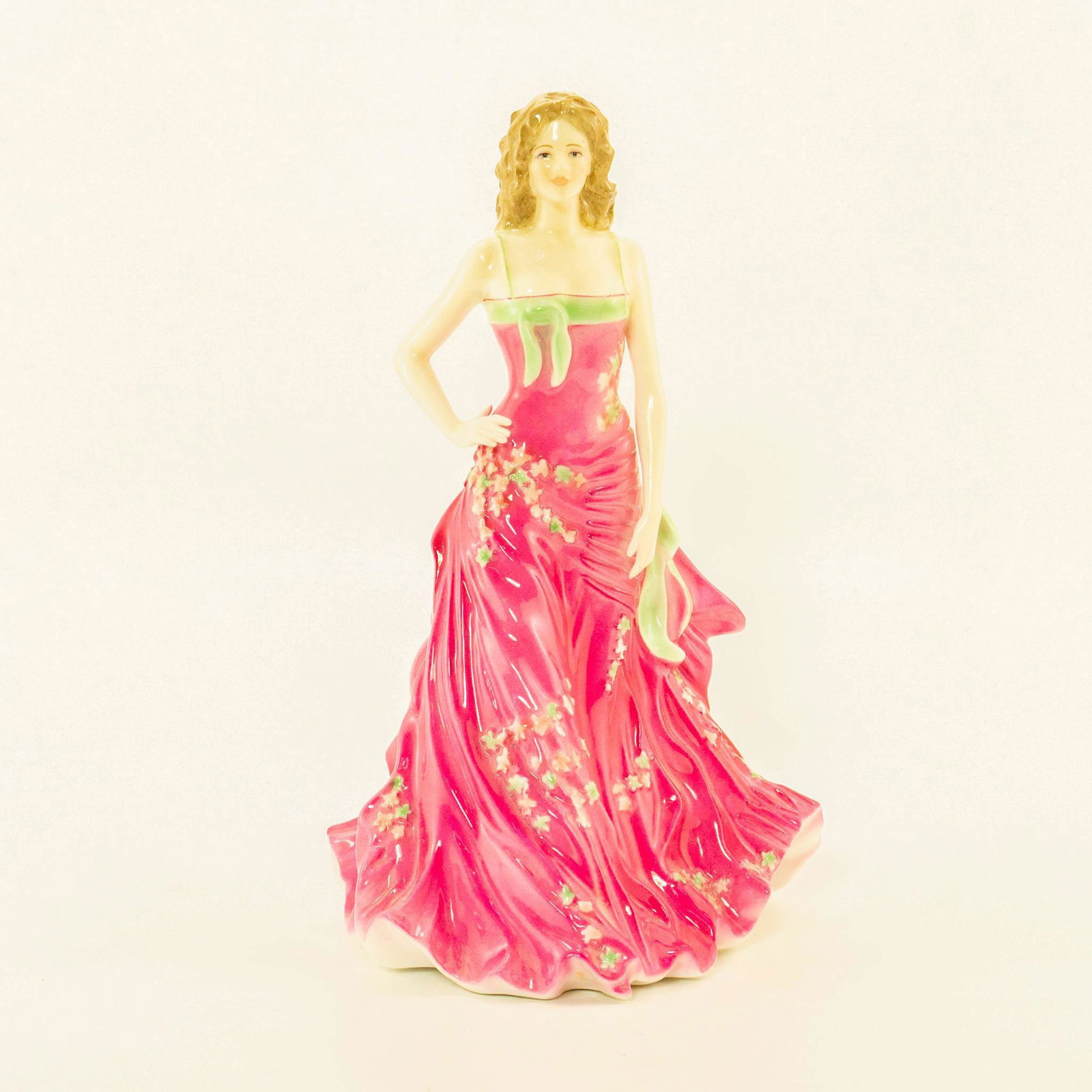 Emily CW 721 - Royal Worcester Figurine: Official Royal Worcester Figure of the year 2005. Limited edition. Pink and green. Royal Worcester backstamp. Issued: 2005 Dimensions: 9.75"H Manufacturer: Royal Worcester Country of Origin: England