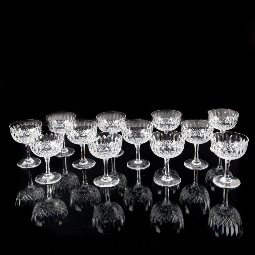 12pc Thomas Webb Normandy Crystal Champagne Glasses: Elegant hand-crafted cut crystal in Normandy pattern. Thomas Webb backstamp. Thomas Webb began his glass career in 1829, when he became a partner of the Wordsley Glassworks. Soon after, he also inheri