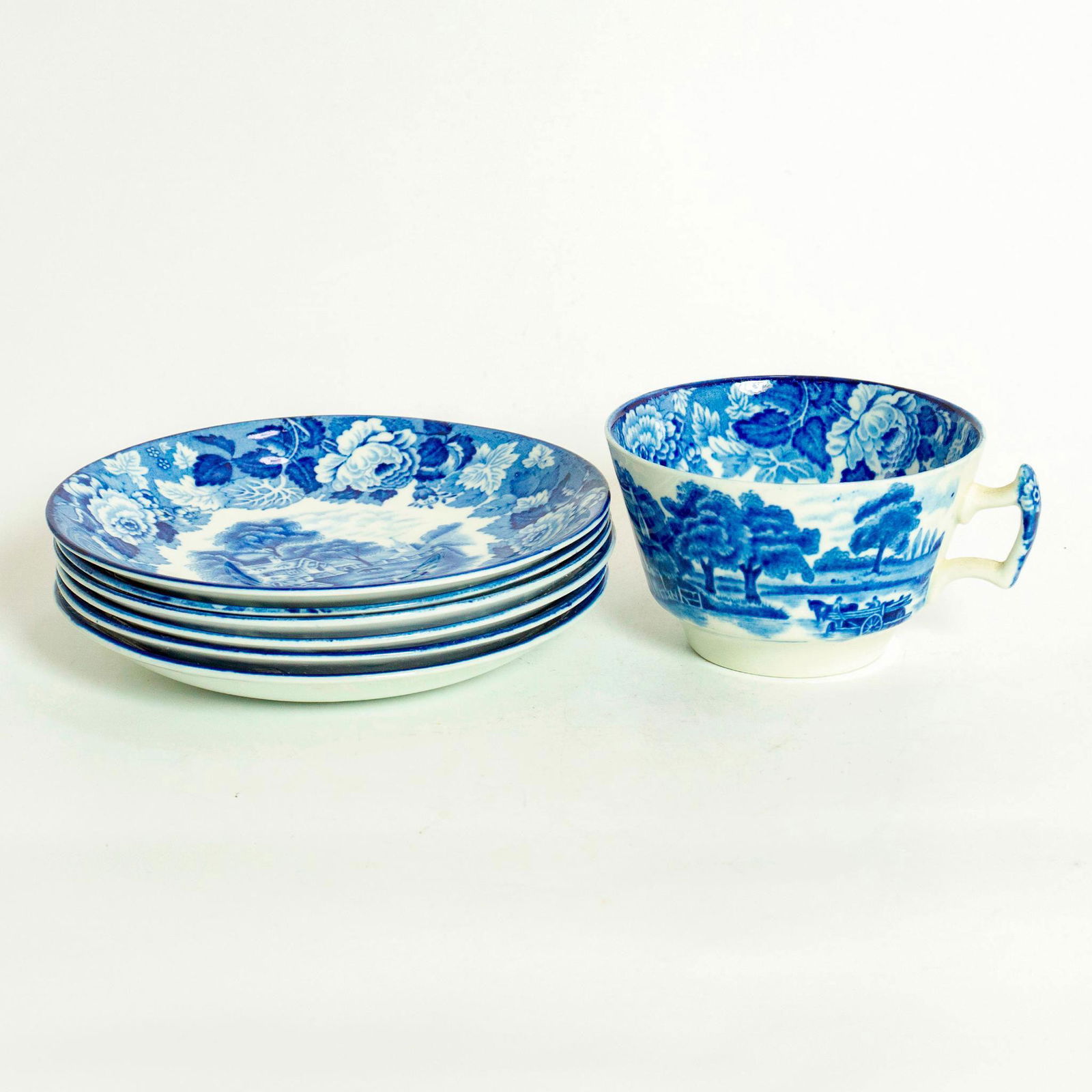 6 Woods Ware English Scenery Enoch Tea Cups & Saucers: Blue and white floral patterns with English scenery. Includes 6-tea cups and 6-saucers. Marked Enoch Woods English Scenery. Wood & Sons backstamp. Issued: 20th c. Dimensions: 2.25"H x 5.62" dia. Manuf