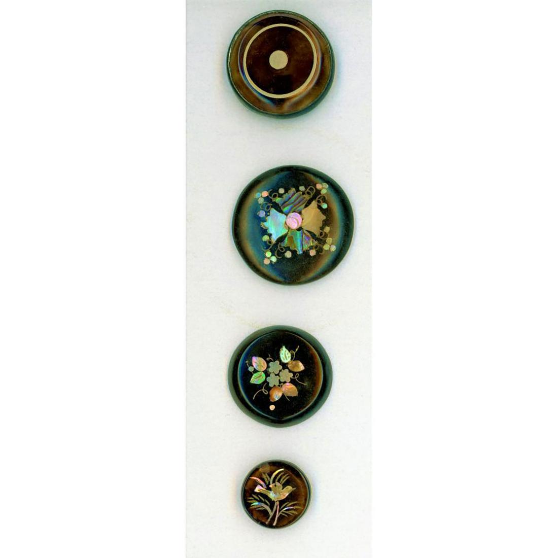A SMALL CARD OF INLAID HORN BUTTONS: 4 Small and medium horn buttons with inlays. The examples includes are inlayed with brass, mother of pearl and silver. Nice group. Dimensions: SM=Less than 3/4", Medium=3/4" to 1 1/4". Large=1 1/4" an