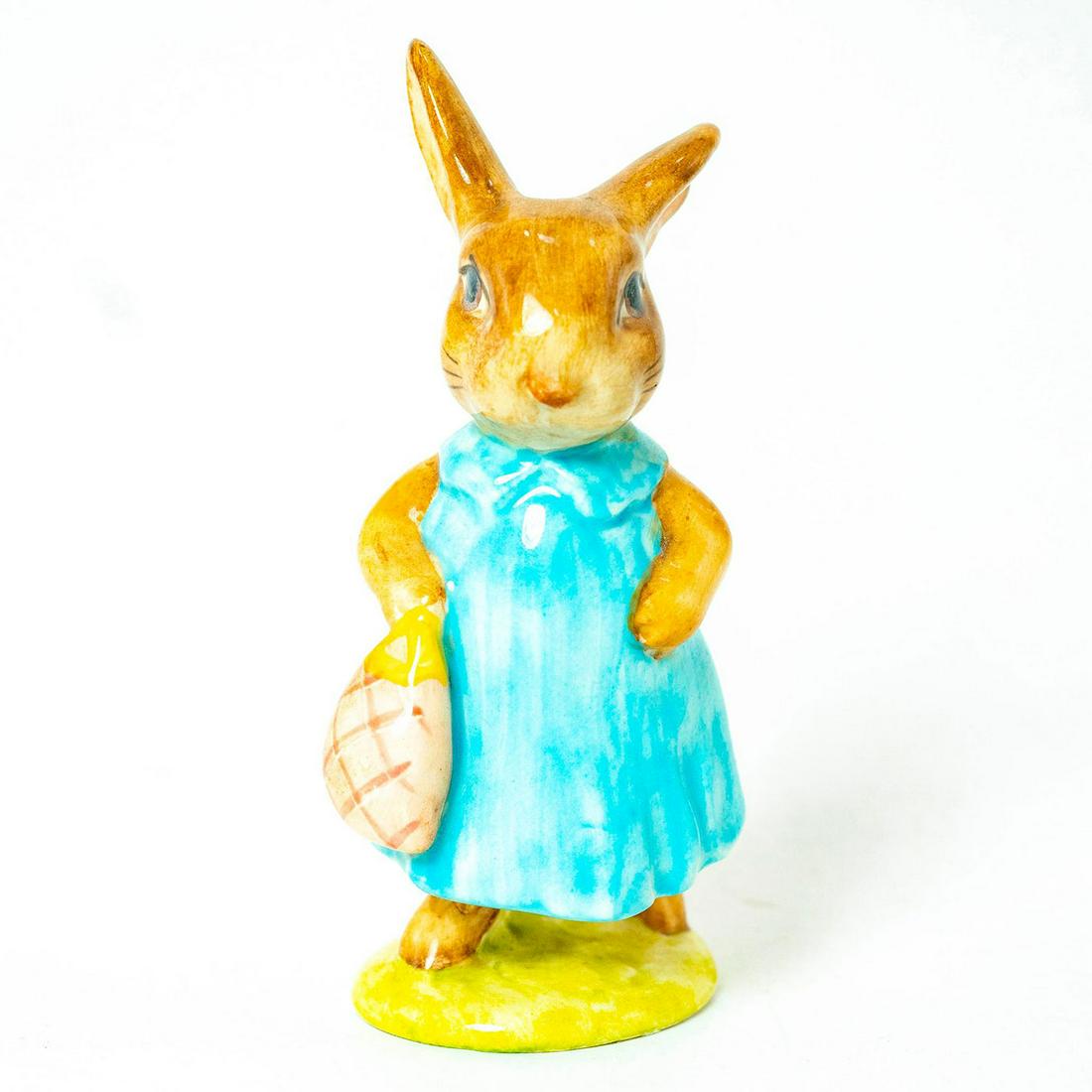 Mrs. Flopsy Bunny - Beswick - Beatrix Potter Figurine: Beswick Brown Line Backstamp. Dark/ Light blue dress, pink bag. Artist: Arthur Gredington Issued: 1973 - 1988 Dimensions: 4''H Country of Origin: England Manufacturer: Beswick