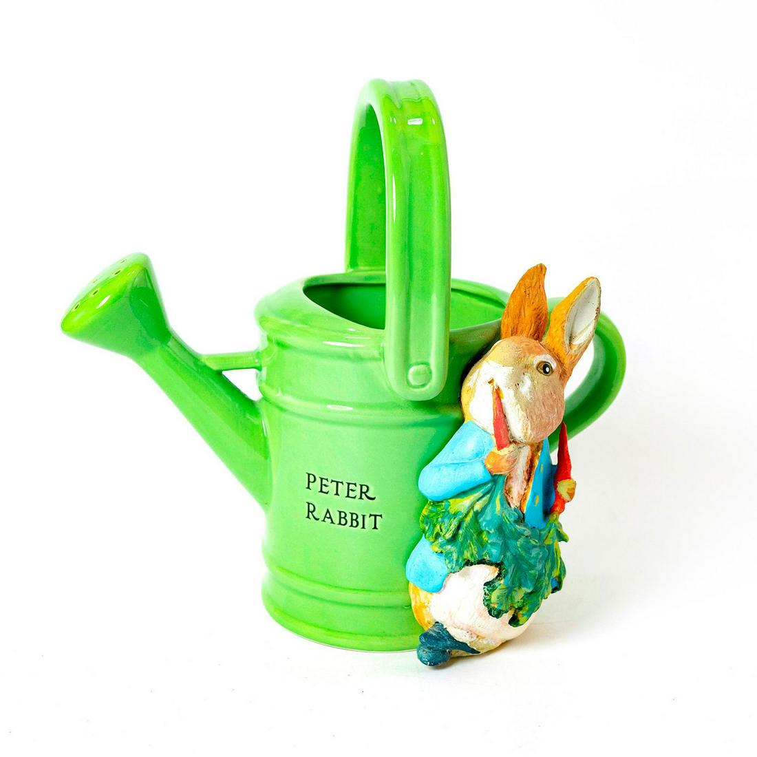 Teleflora Girft, Beatrix Potter, Peter Rabbit Watering: Peter rabbit eating carrots on the side of a watering can. Beatrix Potter backstamp. Issued: 2007 Dimensions: 9.5"H Country of Origin: China Manufacturer: Frederick Warne and Co