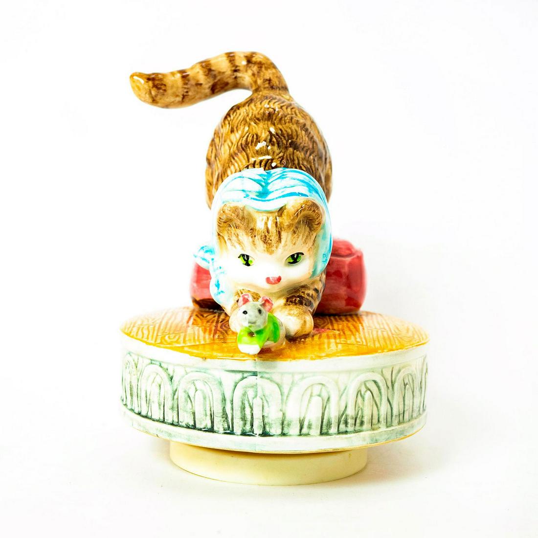 Schmid Music Box, Beatrix Potter, Miss Moppet: Cat chases mouse on hardwood designed rotating base that plays music. Schmid backstamp. Original manufacture's label. Inscription on side reading 'Beatrix Potter, Miss Moppet'. Issued: 1980 Dimensions