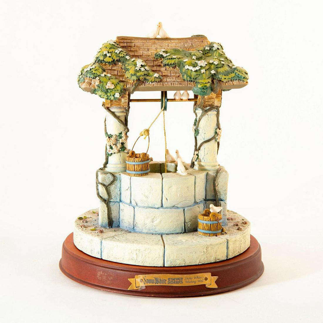 Disney Classics Decoration, Snow White's Wishing Well: A beautifully detailed recreation of Snow White's wishing well with base. Includes original box. Includes certificate. Issued: 2000 Dimensions: 7"H Country of Origin: Thailand Manufacturer: Disney