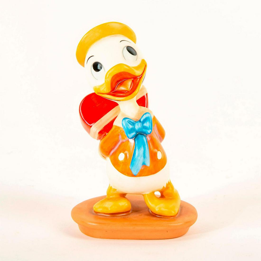 Disney Classics Figurine, Dewey, I Got Somethin' For Ya: Dewey hides a heart shaped box of chocolates behind his back. Includes original box. Includes certificate. Dimensions: 4"H Country of Origin: Thailand Manufacturer: Disney