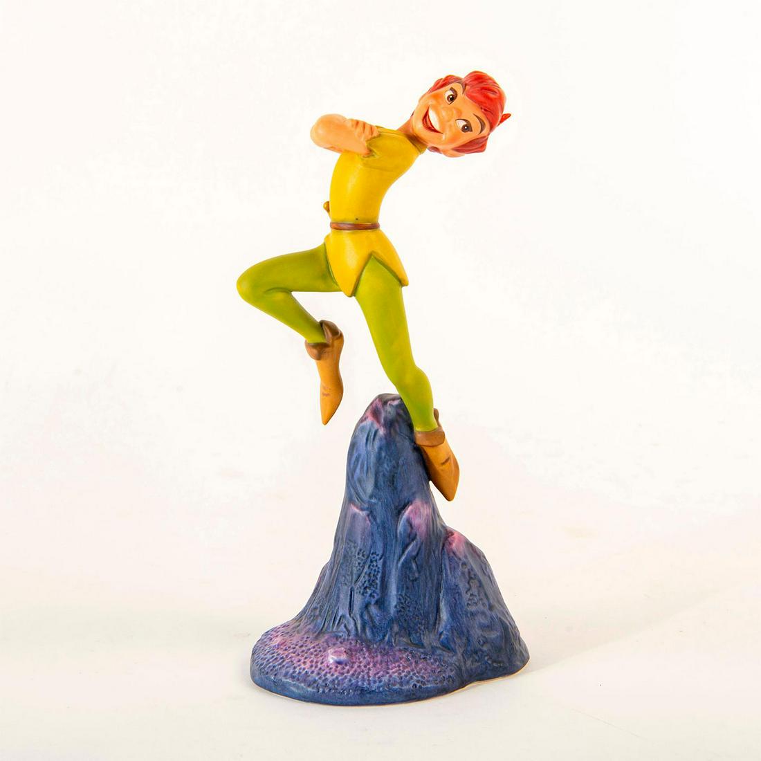 Disney Classics Figurine, Nobody Calls Pan a Coward: Peter Pan skipping across the sky. Includes original box. Includes certificate. Issued: 2000 Dimensions: 7.5"H Country of Origin: Thailand Manufacturer: Disney