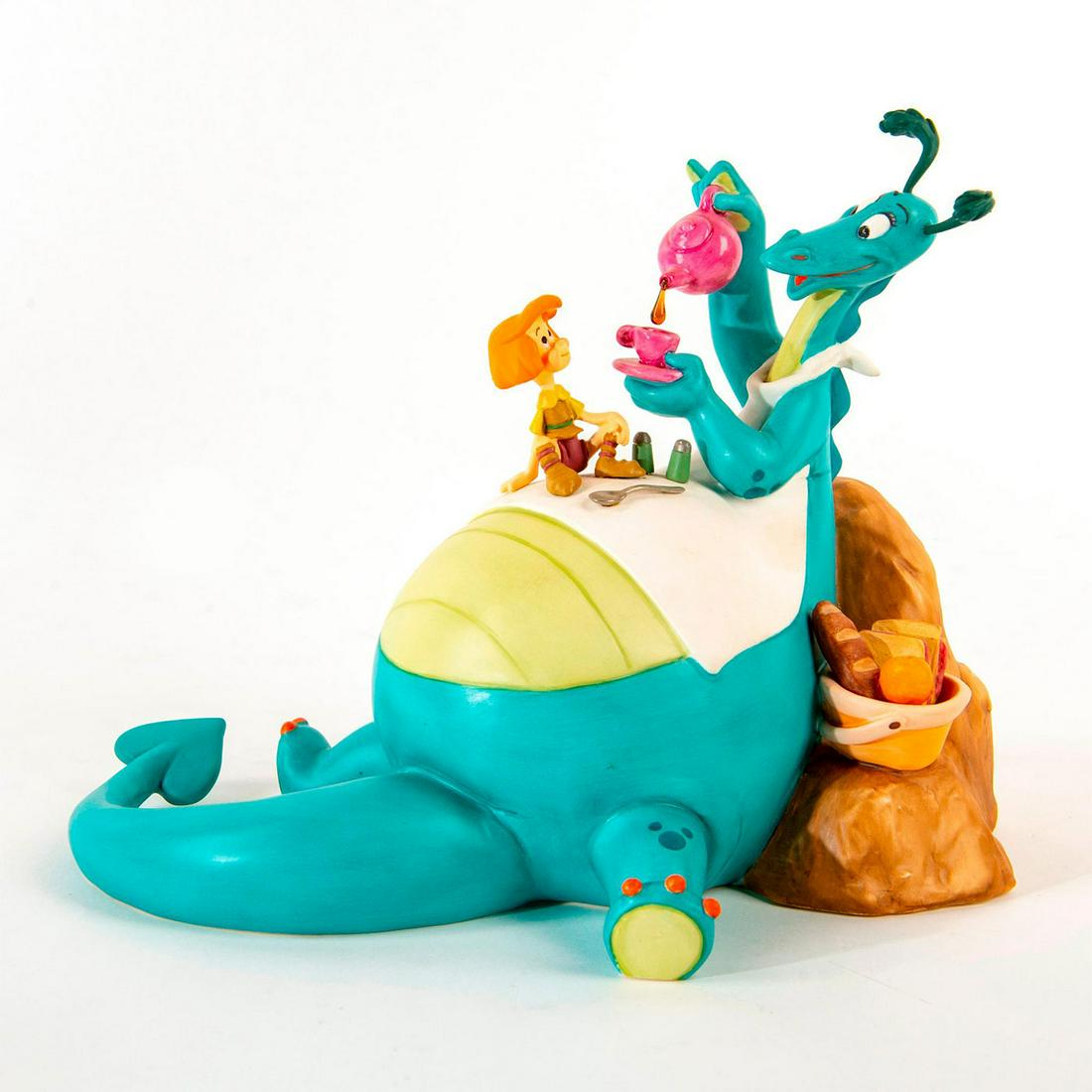 Disney Classics Figurine, The Reluctant Dragon: Titled "The More the Merrier". Boy sits on the belly of the dragon as they share some tea. Includes original box. Includes certificate. Dimensions: 6.75"H Country of Origin: Thailand Manufacturer: Dis