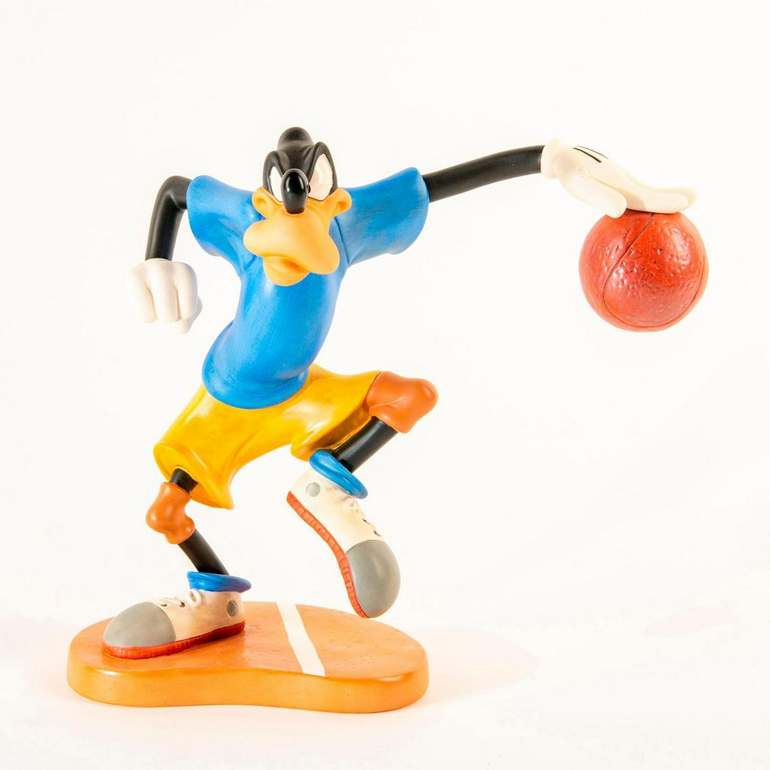 Disney Figurine, Goofy; Dribbling Down Court: Matte finished figurine; Goofy in blue shirt and yellow shorts with basketball. With box. Certificate Included. Dimensions: 8"H Country of Origin: Taiwan Manufacturer: Disney