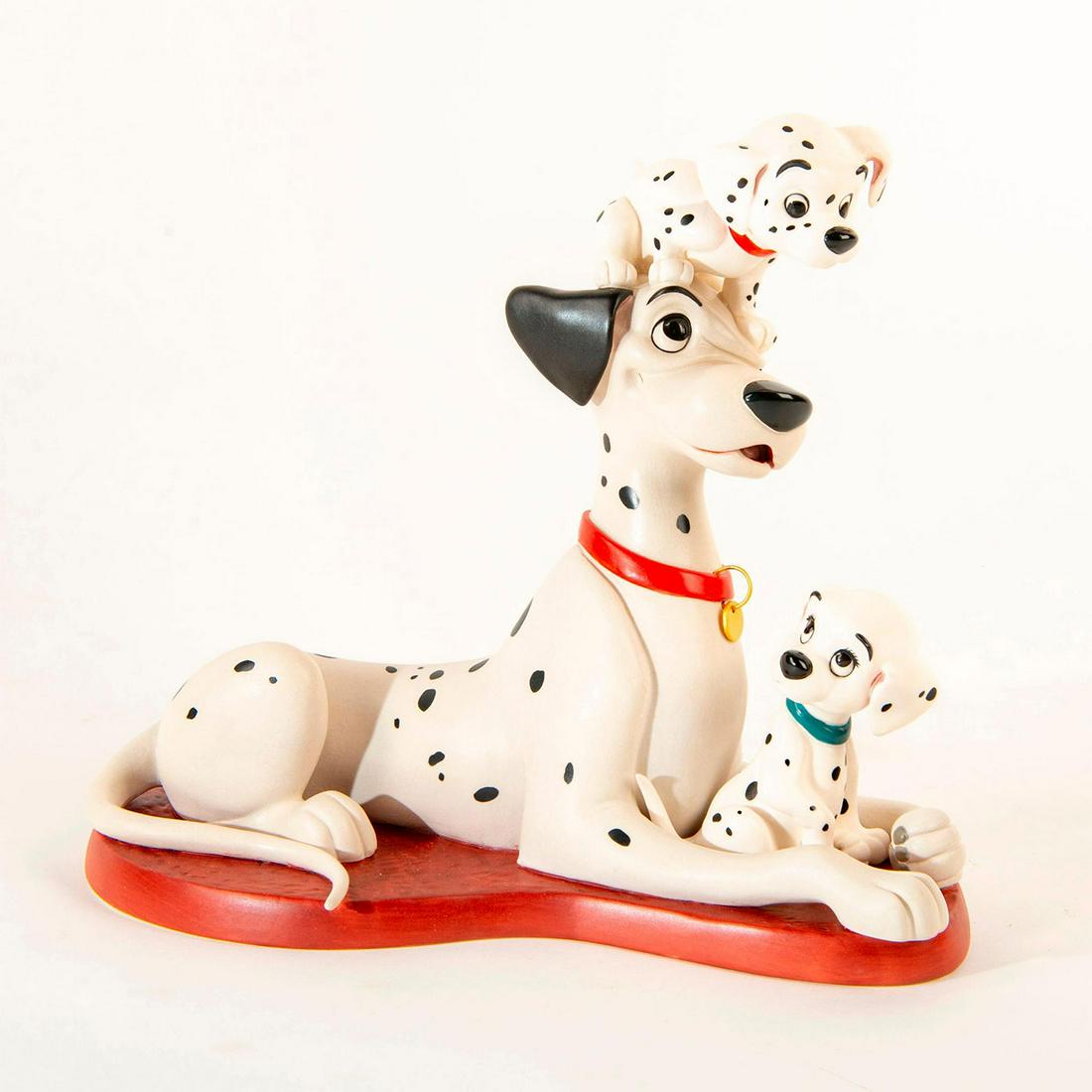 Disney Figurine, Proud Pongo From 101 Dalmatians: Matte finished figurine; Pongo the black spotted dog laying down, with two puppies. With Box. Certificate Included. Dimensions: 7"H Country of Origin: Taiwan Manufacturer: Disney