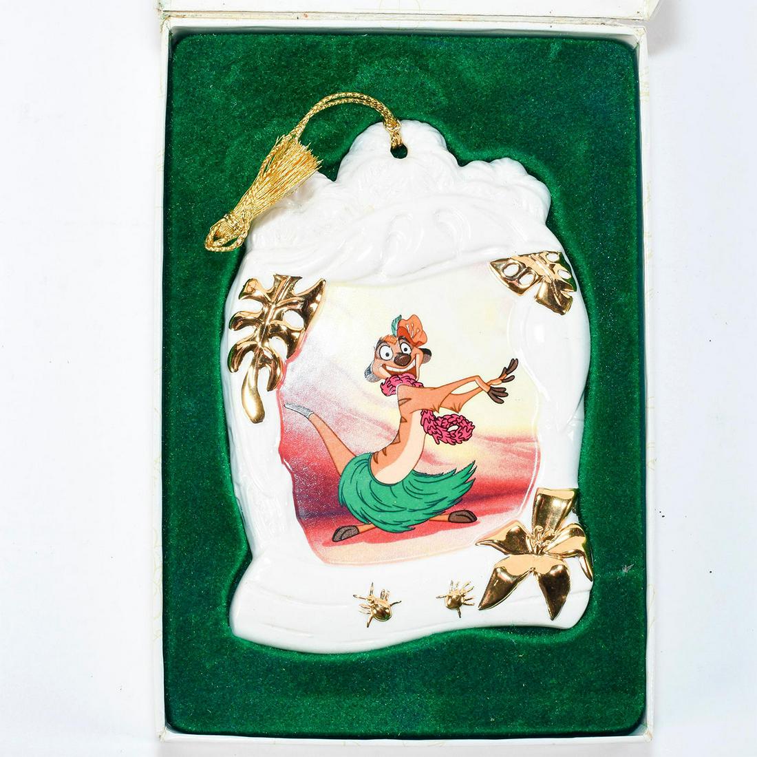 Disney Classics Ornament, Timon, Luau, Lion King: Ceramic ornament with Timon gleefully dancing in luau attire. Backstamp - 1998 Walt Disney Collectors Society Ornament, "Luau!", Timon, The Lion King. Gilt decoration. #disney #lionking Issued: 1998 D