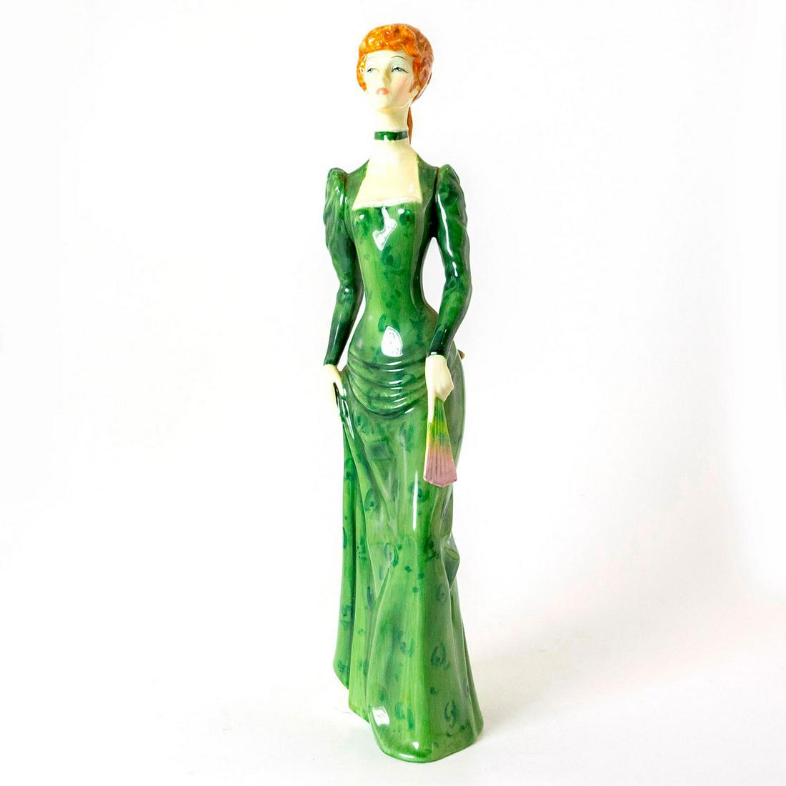 A la Mode HN2544 - Royal Doulton Figurine: Part of the Haute Ensemble series. Lady in elegant green dress. Royal Doulton backstamp. Artist: Eric J. Griffiths Issued: 1974 - 1979 Dimensions: 12.25"H Manufacturer: Royal Doulton Country of Origin